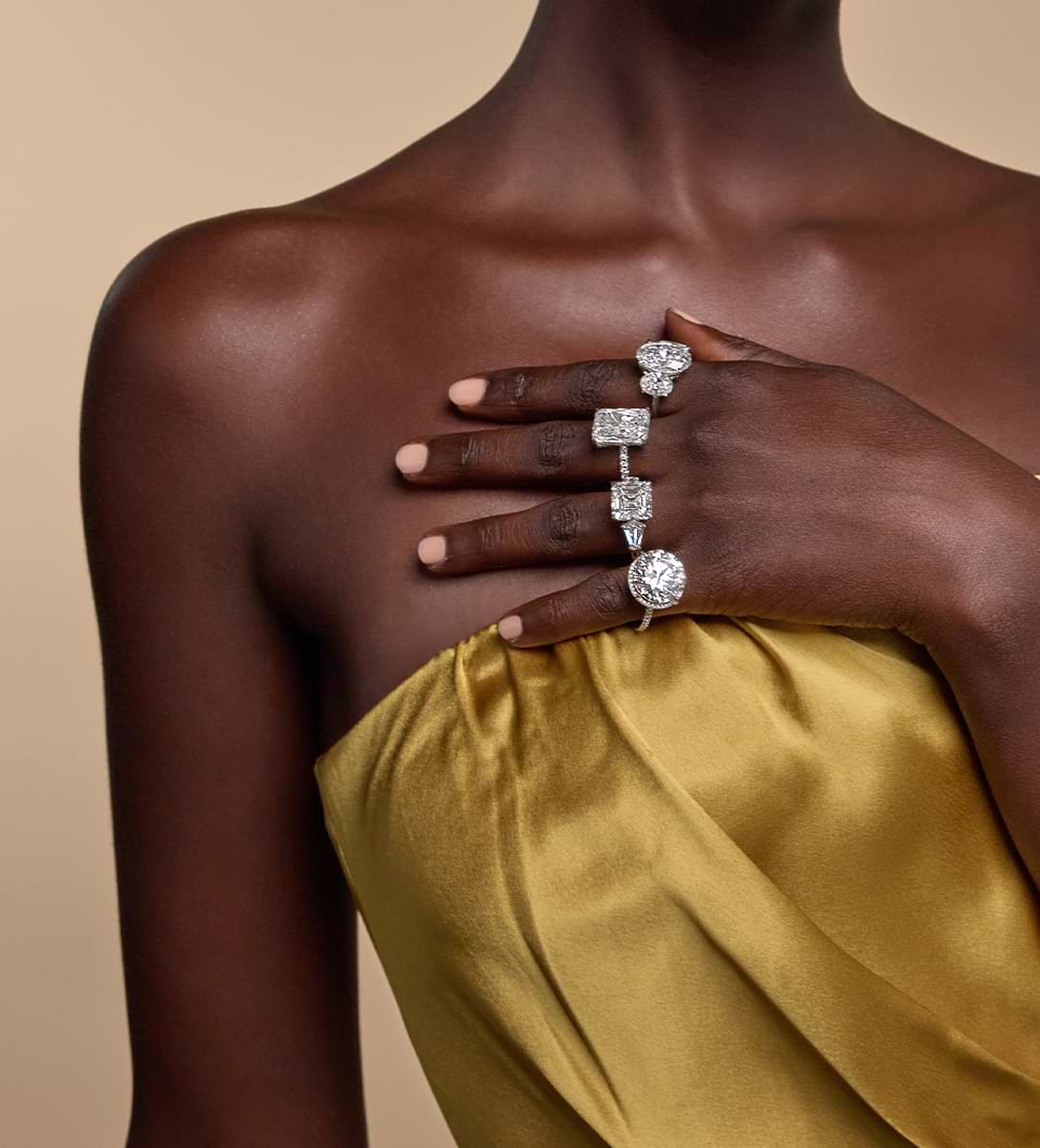 A girl is standing with wearing multi shapes diamond Engagement Rings