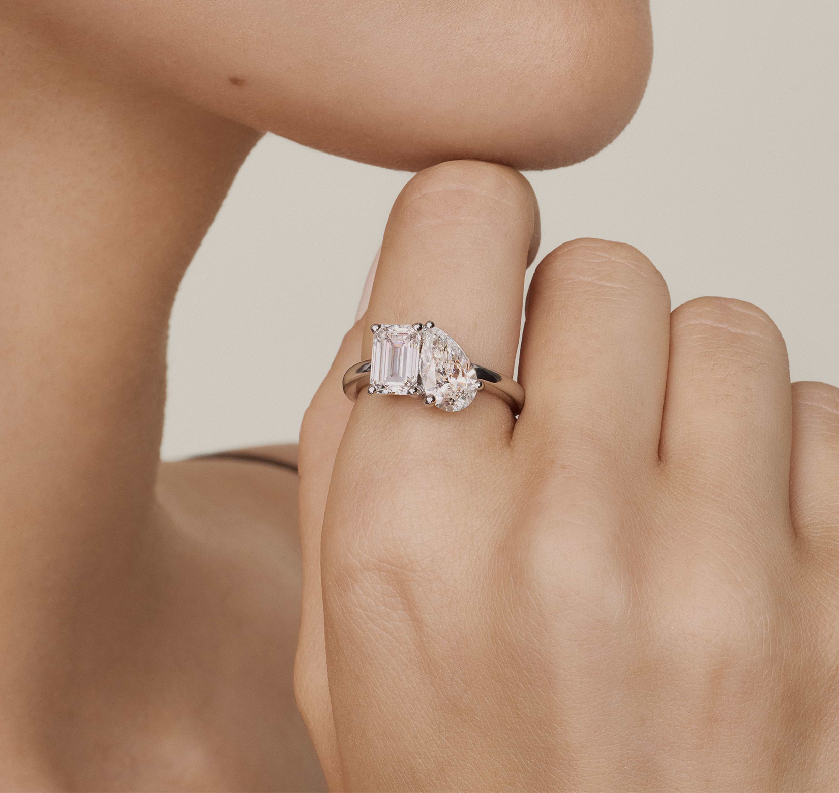 Elegant two-stone diamond ring on a hand, with “Special Buys” and “Shop Now” text