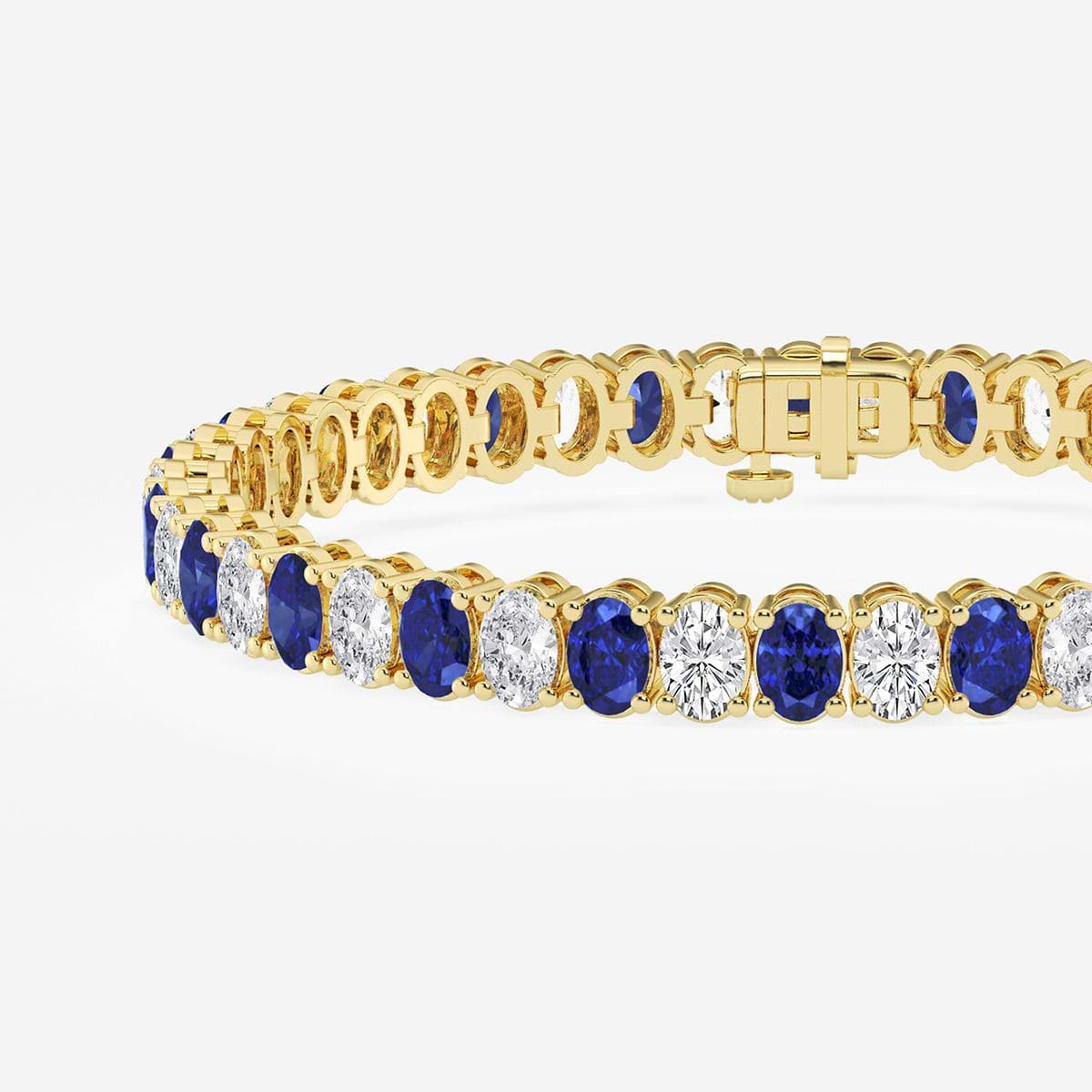 5.1x3.6 mm Oval Created Sapphire and 6 ctw Oval Lab Grown Diamond Four-Prong Tennis Bracelet - 7 Inches 14K Yellow Gold