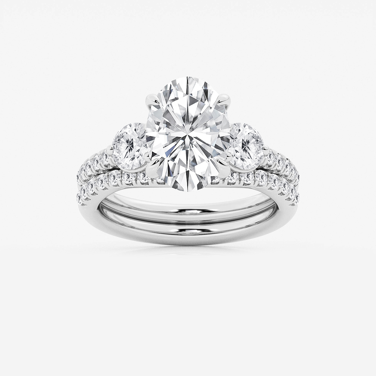 4 1/8 ctw Oval Lab Grown Diamond Three-Stone Bridal Set