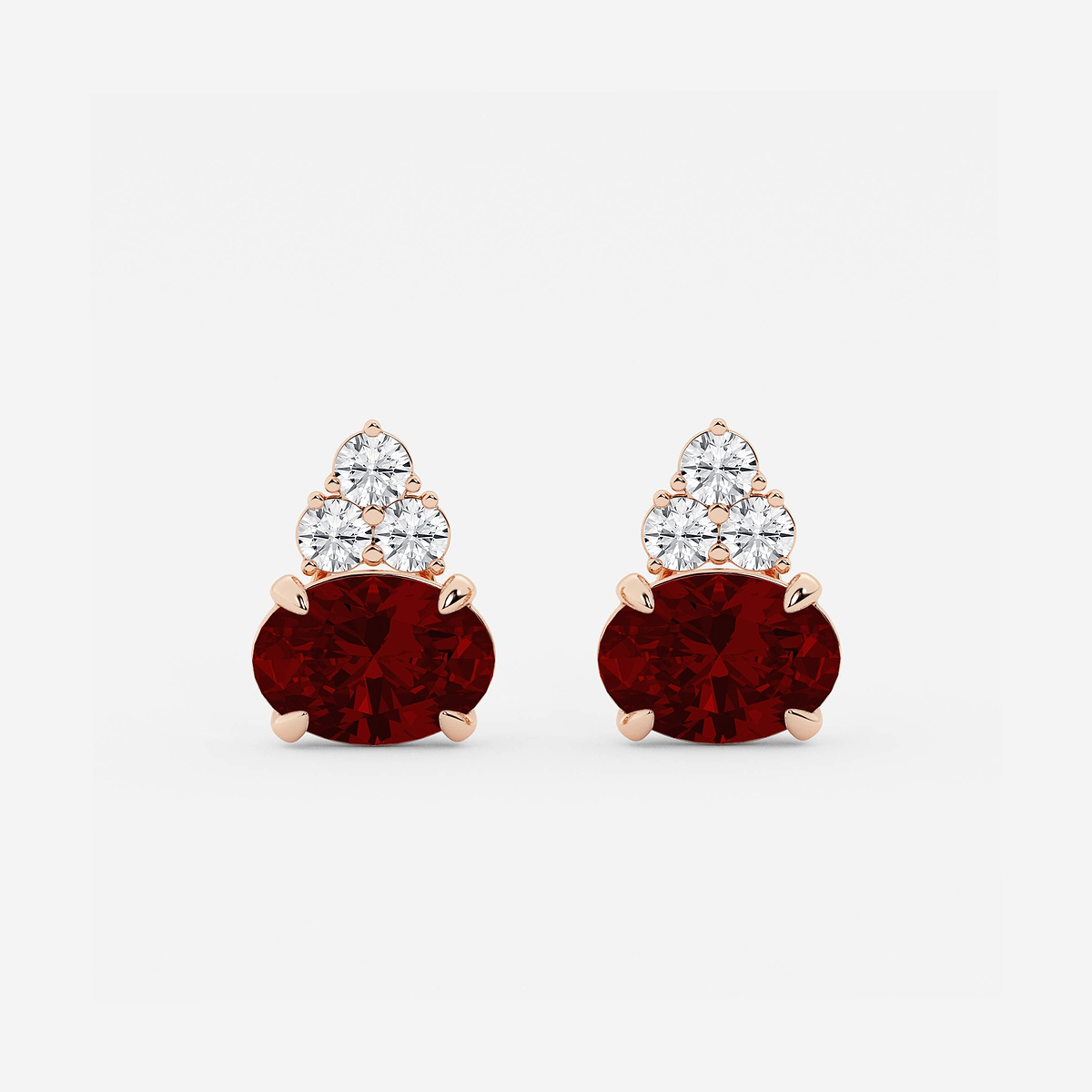 10.7x7.49mm East-West Oval Cut Created Ruby with 3/4 ctw Round Lab Grown Diamond Cluster Earrings