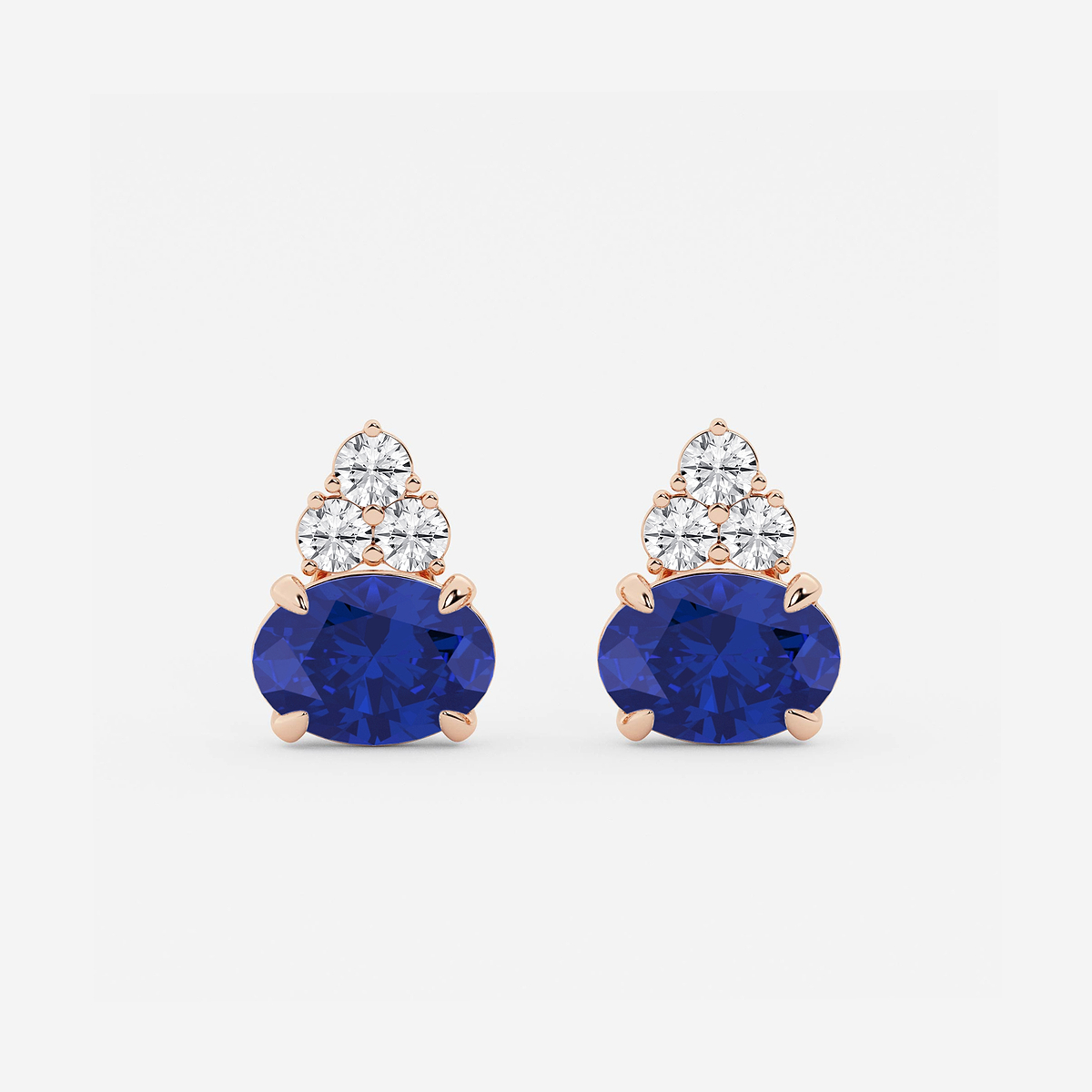 10.7x7.49mm East-West Oval Cut Created Sapphire with 3/4 ctw Round Lab Grown Diamond Cluster Earrings
