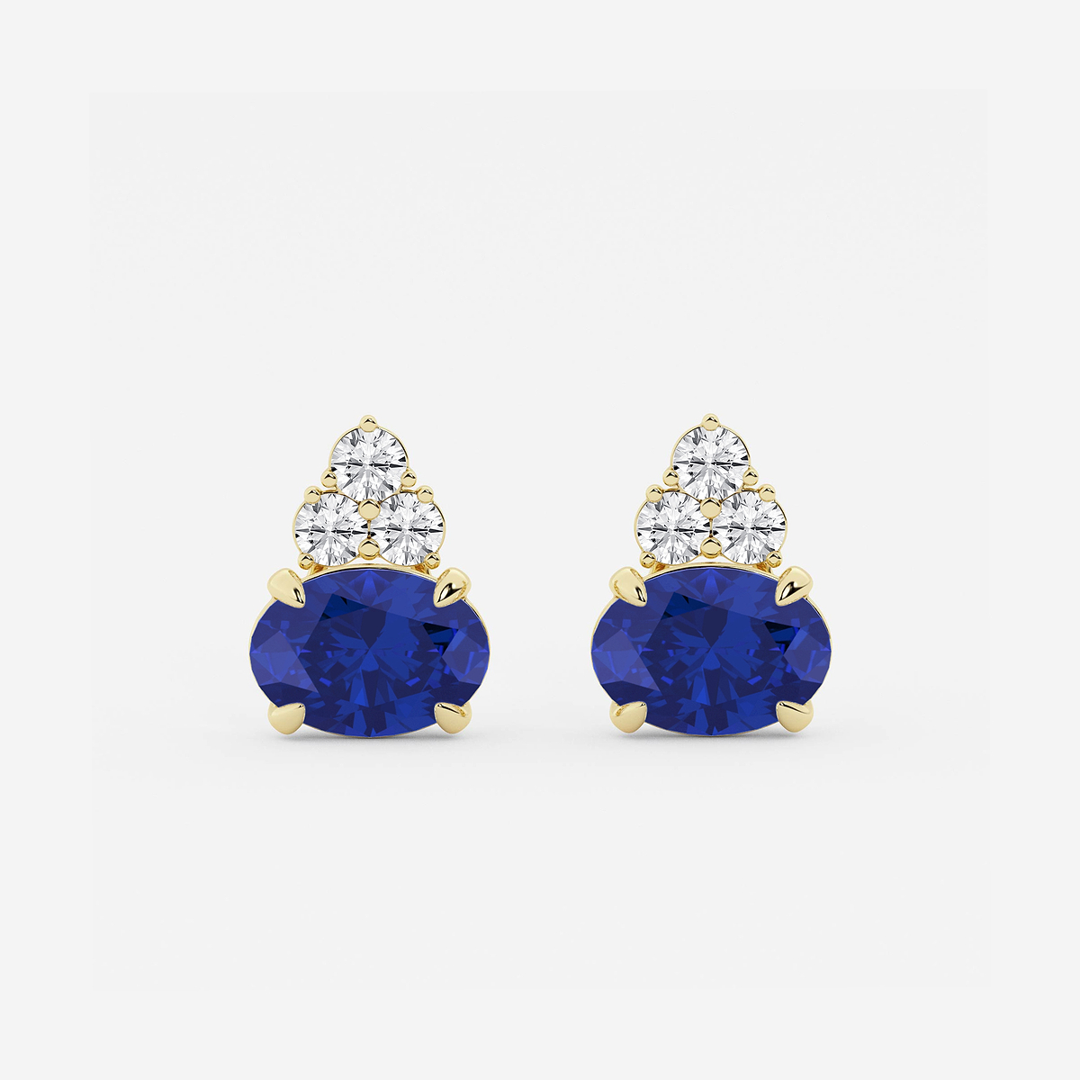 10.7x7.49mm East-West Oval Cut Created Sapphire with 3/4 ctw Round Lab Grown Diamond Cluster Earrings