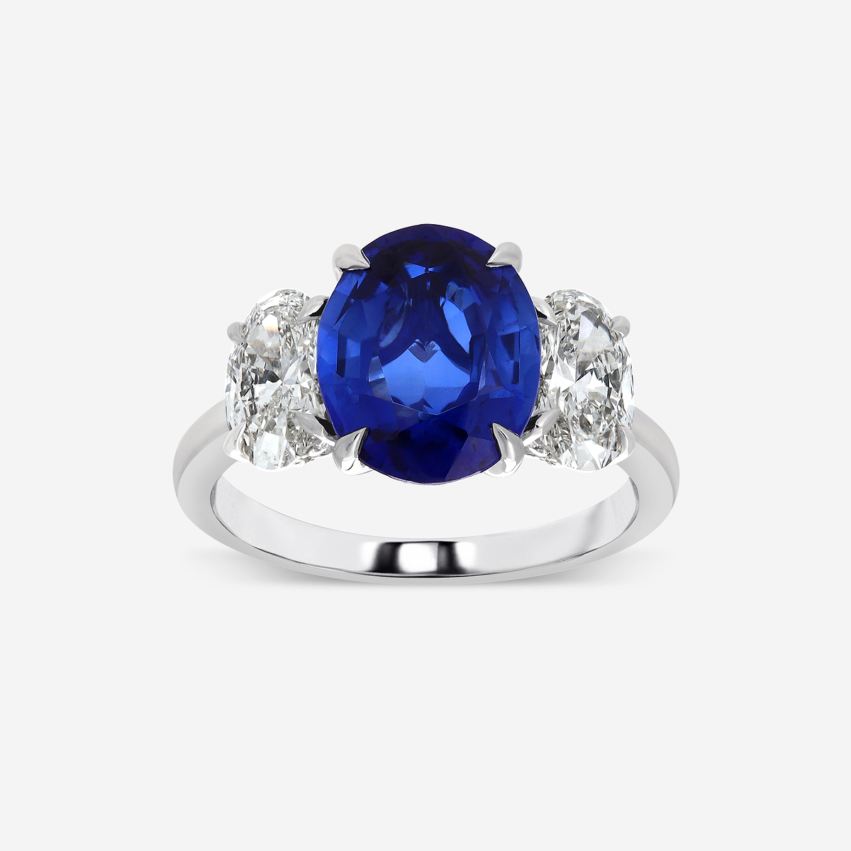 7.7x5.5 mm Oval Cut Created Sapphire and 1 3/4 ctw Round Lab Grown Diamond Three-Stone Engagement Ring