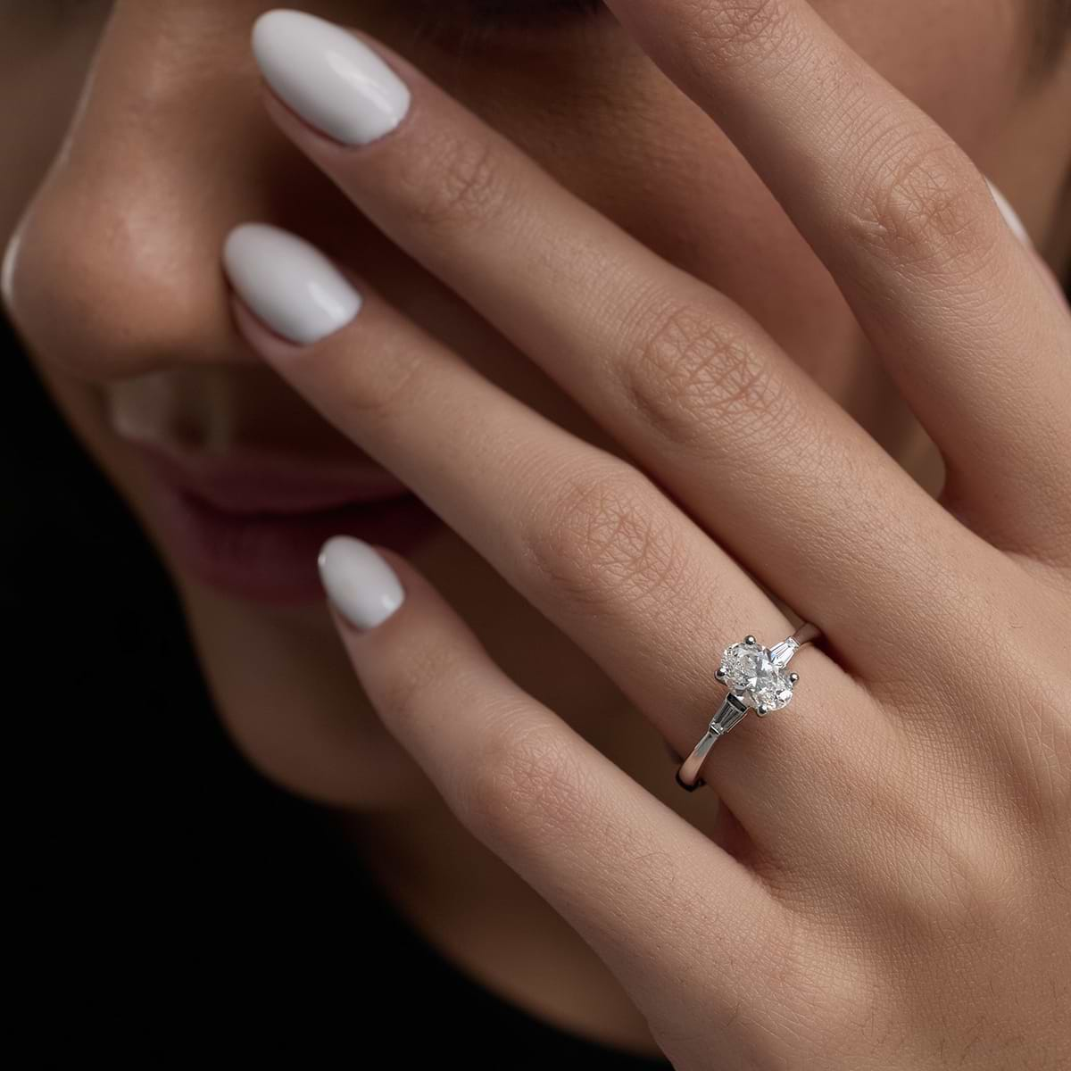 Diamond ring with shops baguettes on side