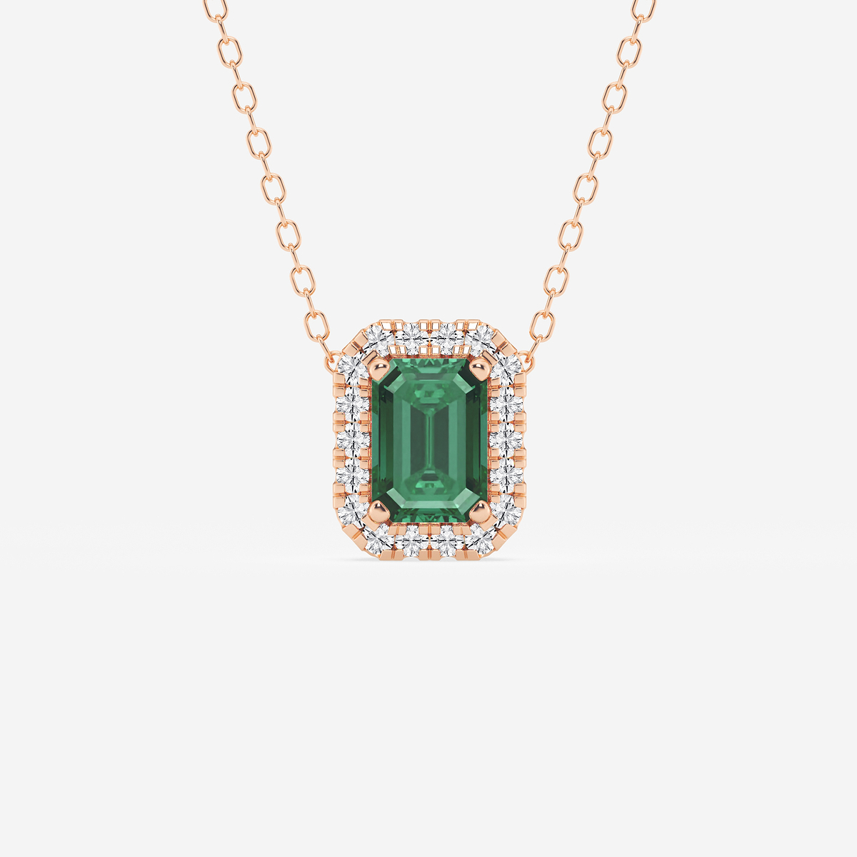 6.7x4.69 mm Created Emerald and 1/5 ctw Round Lab Grown Diamond Halo Pendant with Adjustable Chain