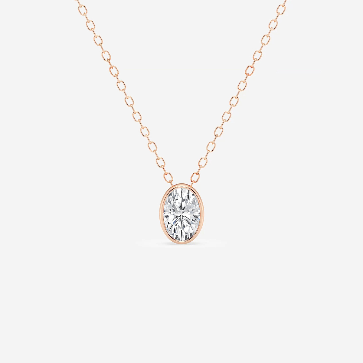 1/2 ctw Oval Lab Grown Diamond Bezel Set Solitaire Pendant with Adjustable Chain
