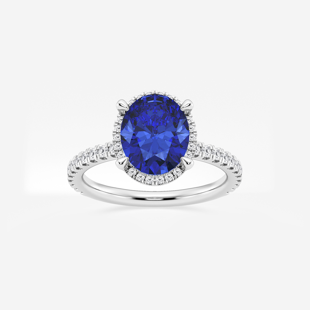 10x8mm Oval Cut Created Sapphire and 2/5 ctw Lab Grown Diamond Halo Engagement Ring