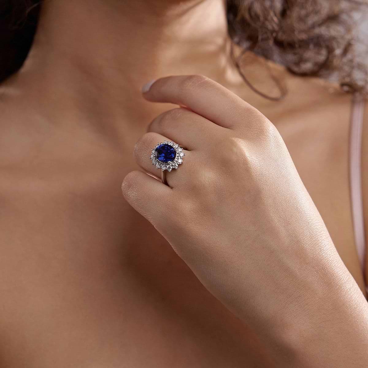 11x9 mm Oval Cut Created Sapphire and 7/8 ctw Lab Grown Diamond Halo Engagement Ring