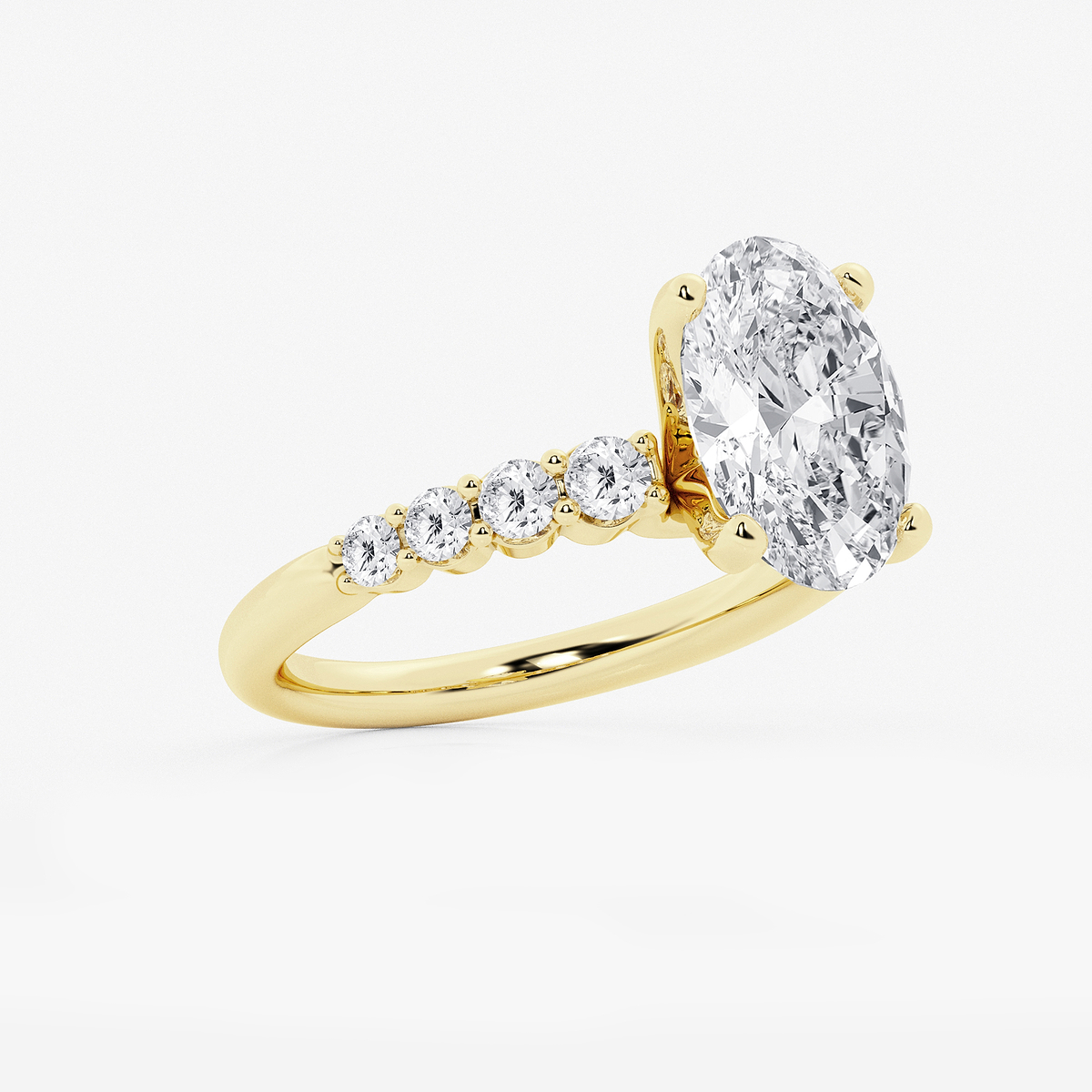 4 1/6 ctw Oval Lab Grown Diamond Graduated Engagement Ring 14K Yellow Gold, E, VS1